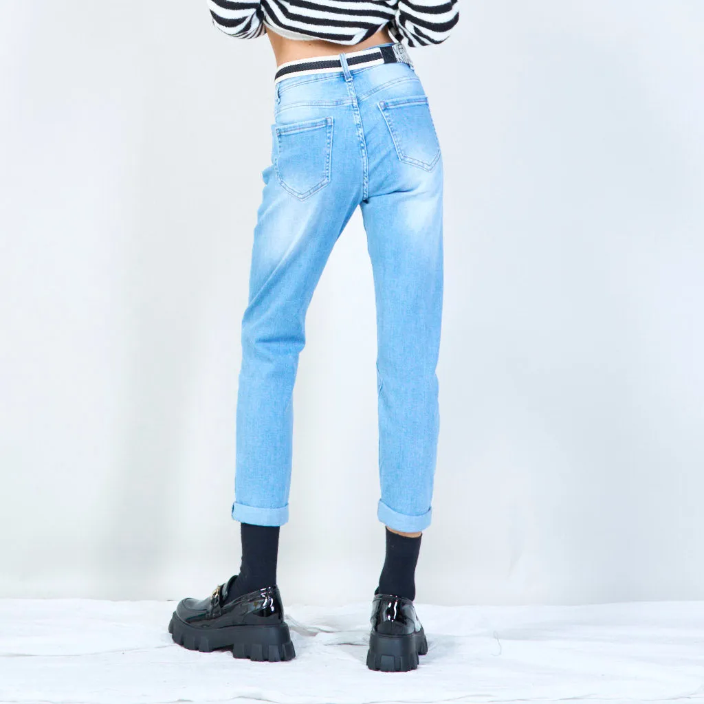 Distressed jeans with statement belt wholesale