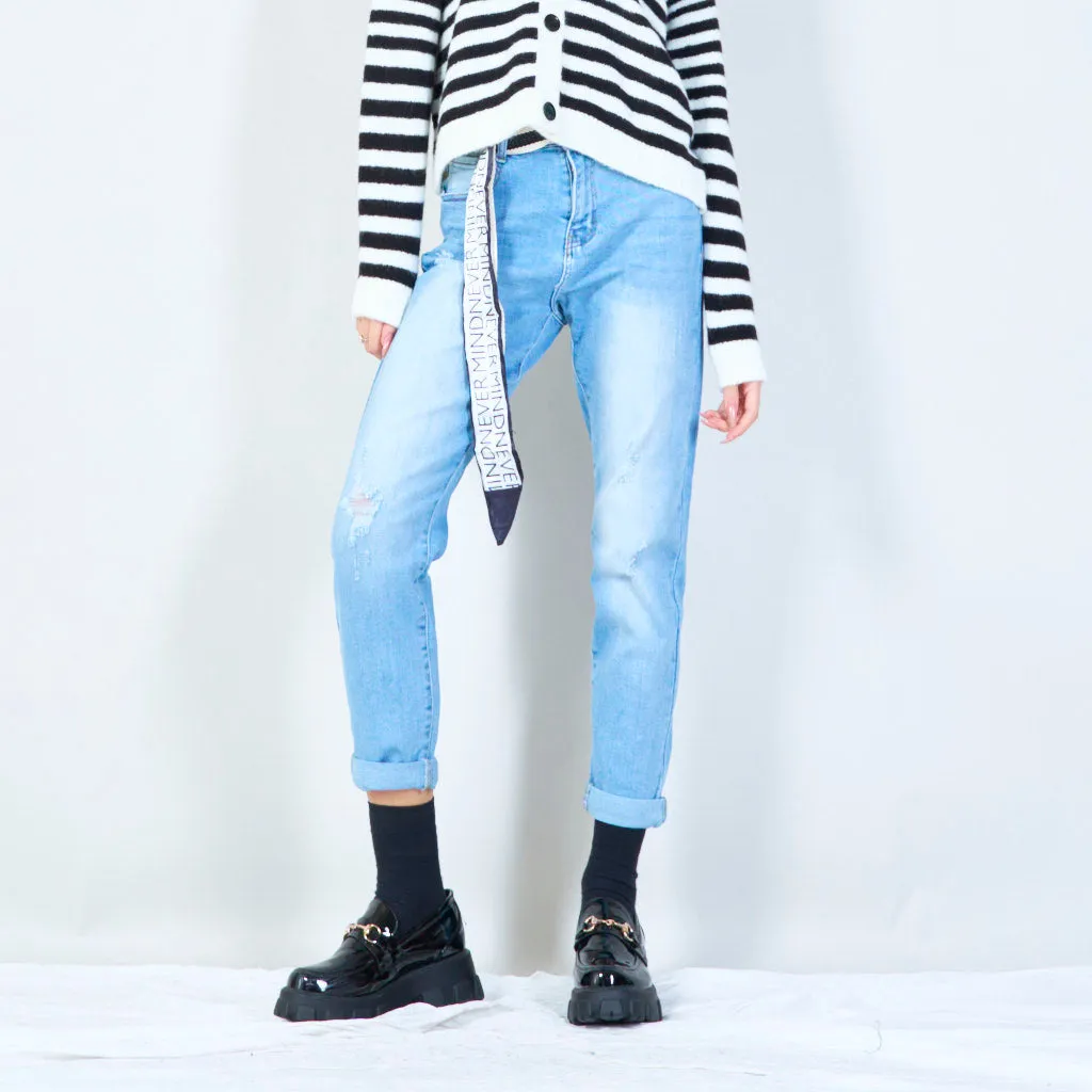 Distressed jeans with statement belt wholesale